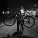 Ann Arbor resident Michael Theodore works on a friend's bike in Kerrytown. (idafey)